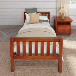 Wooden twin bed with beige bedding and a matching nightstand in a cozy bedroom setting.