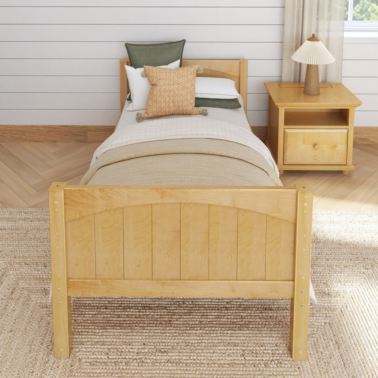 Wooden twin bed with cozy bedding and a matching nightstand in a stylish, modern bedroom.