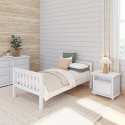 Cozy minimalist bedroom with white wooden bed, bedside table, and soft lighting.