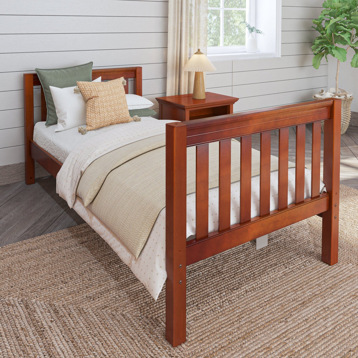 Wooden twin bed frame in cozy bedroom with neutral bedding and decorative pillows.