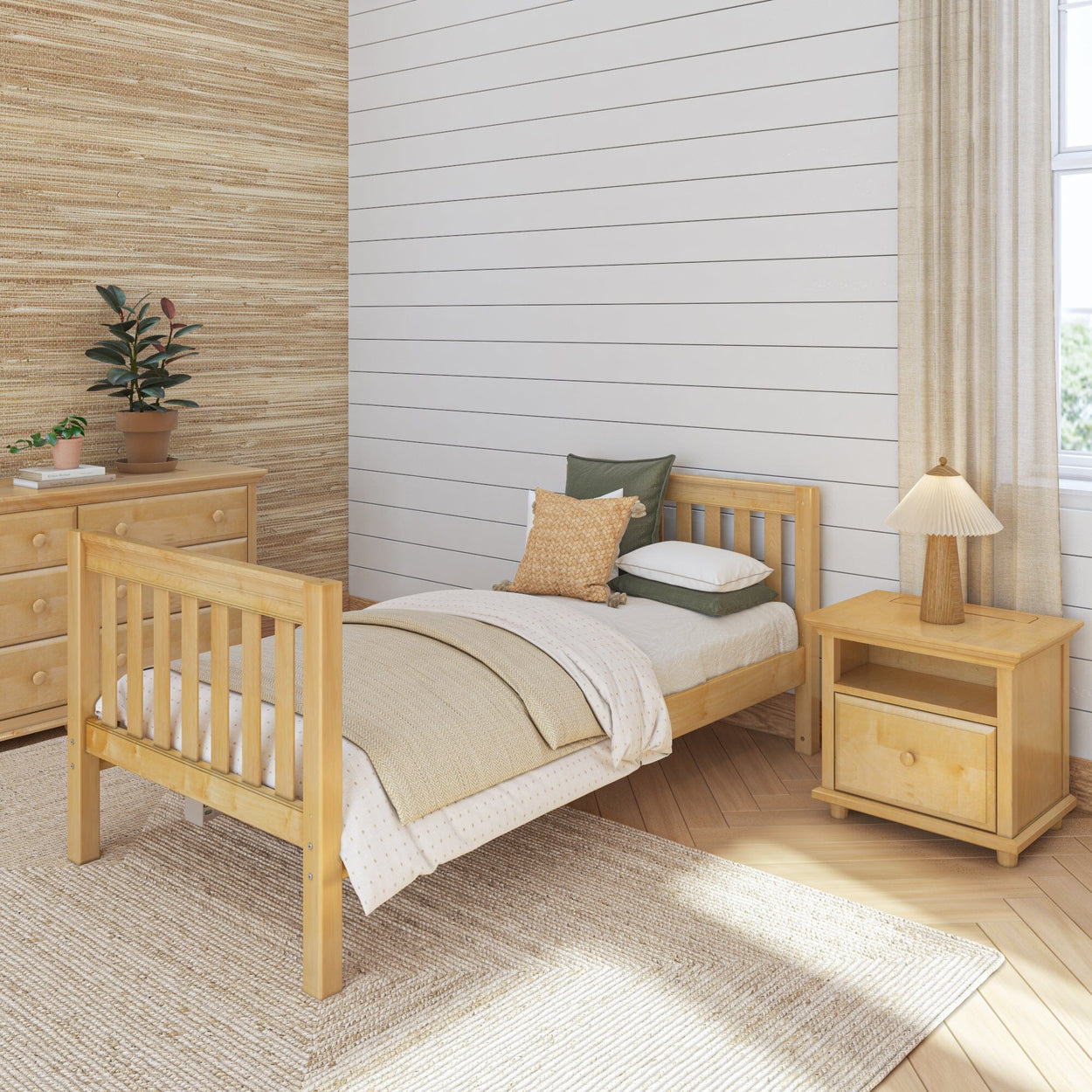 Cozy modern bedroom with wooden furniture, single bed, nightstand, and dresser, featuring neutral colors and natural light.