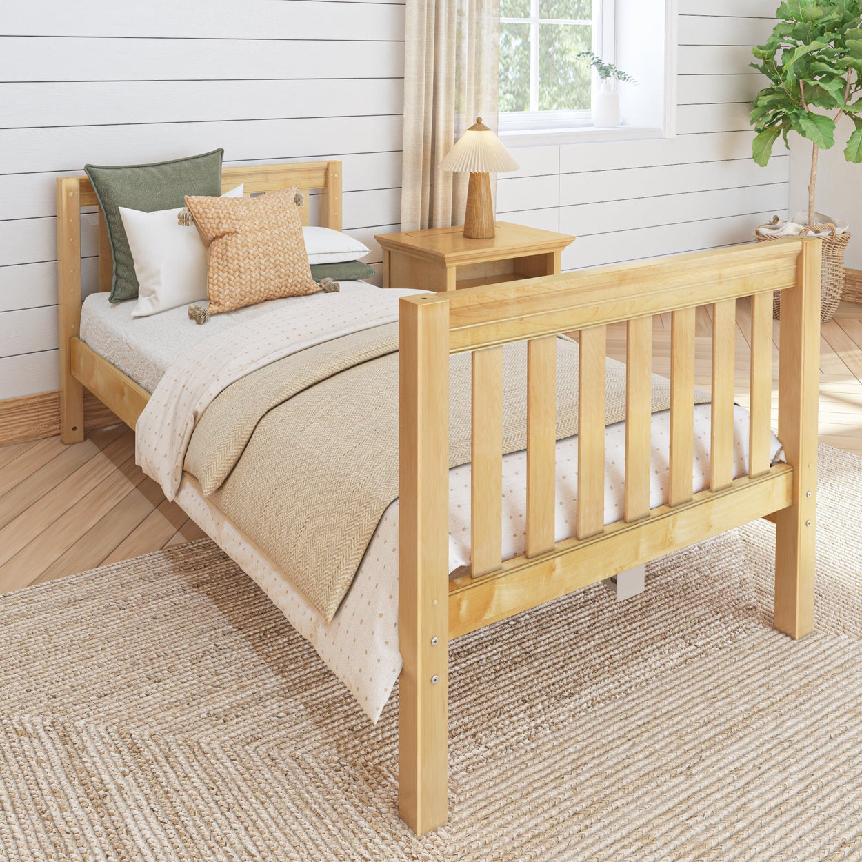 Single wooden bed frame with cozy bedding and decorative pillows in a bright, modern bedroom.