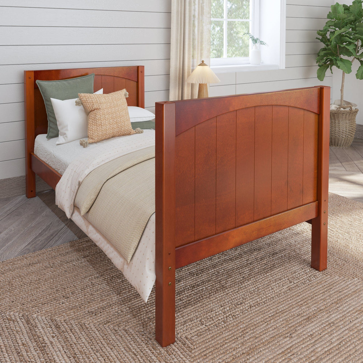 Wooden bed frame with cozy bedding in a modern bedroom setting.