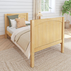 Natural wood bed frame in cozy bedroom with modern decor and indoor plant.
