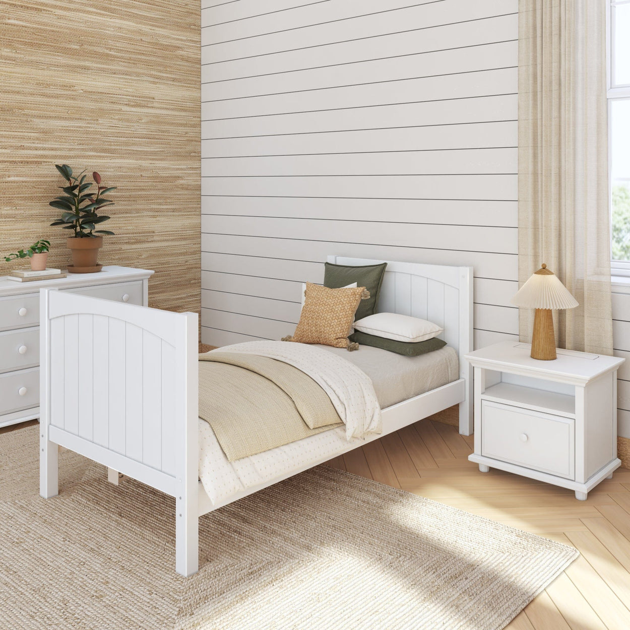 Cozy modern bedroom with wooden single bed, beige bedding, white nightstand, and indoor plants.