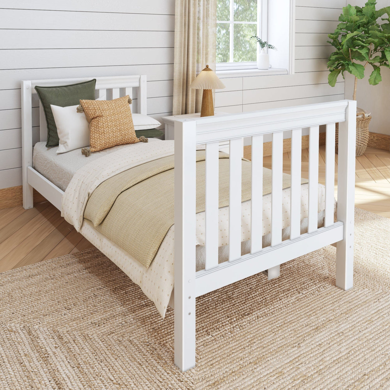 White wooden bed frame in cozy bedroom with beige bedding and wicker rug.