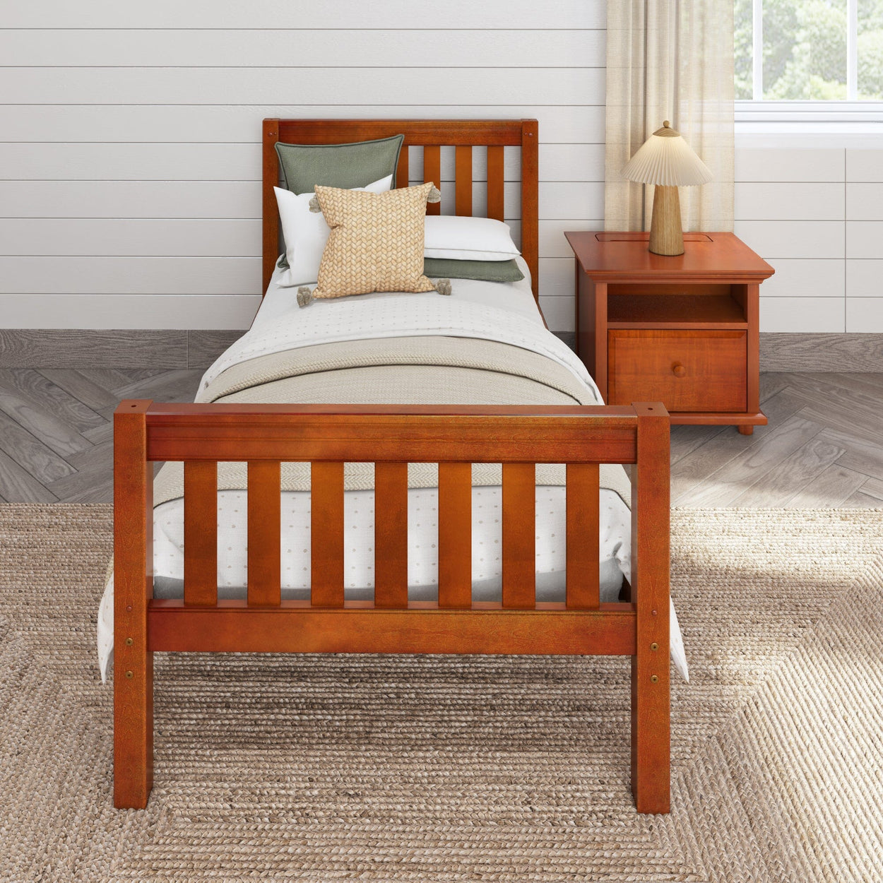 Wooden twin bed frame with a slatted design, accompanied by a nightstand, in a cozy bedroom with neutral decor.