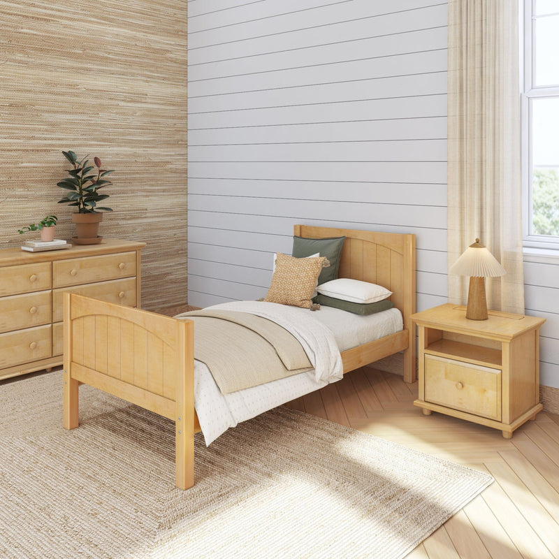 Cozy neutral bedroom with light wood bed and nightstand, beige bedding and woven rug, shiplap white wall, textured grasscloth wallpaper, potted plants and natural light.
