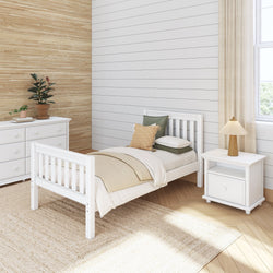 Modern minimalist bedroom with white furniture, including a bed, nightstand, and dresser, featuring neutral decor and a potted plant.