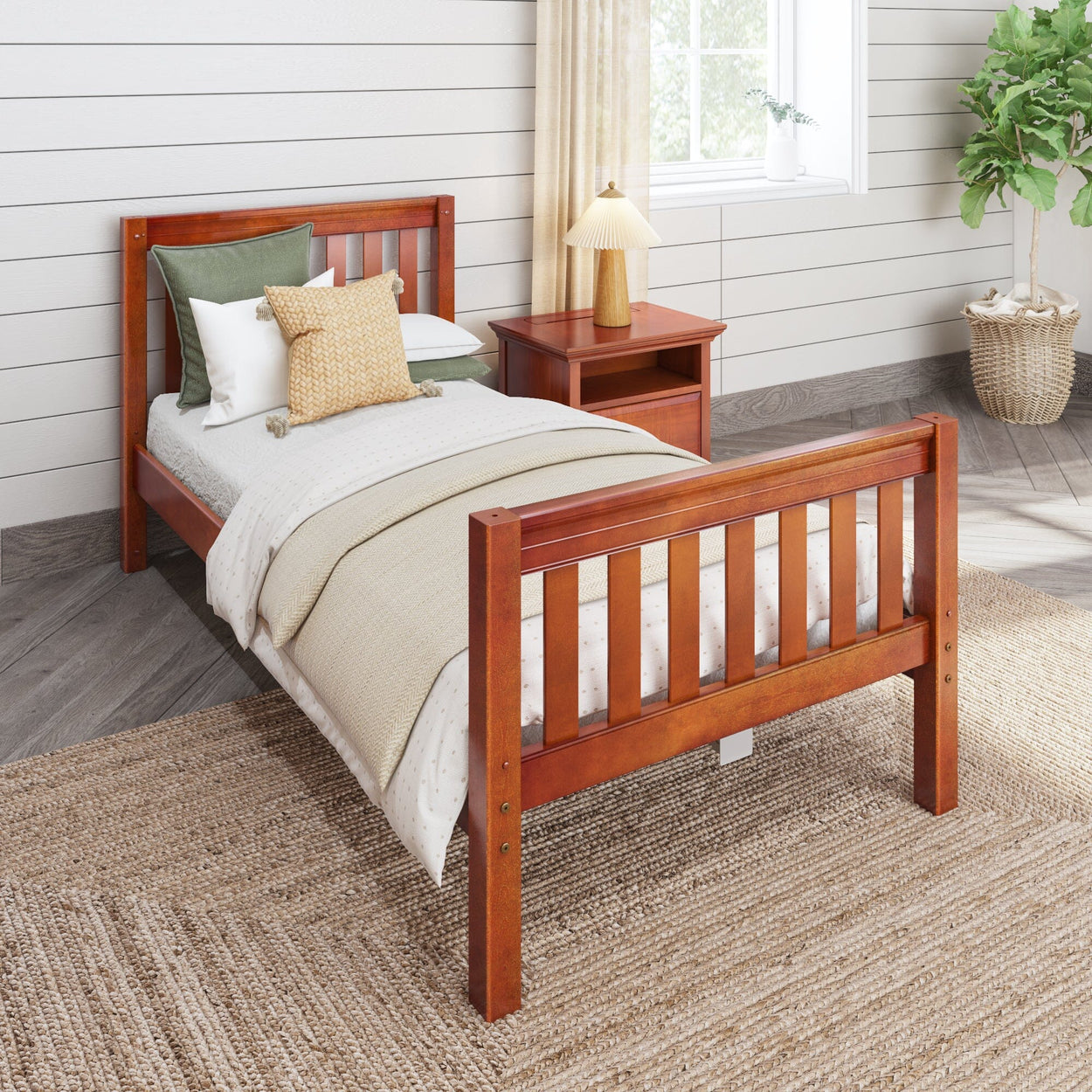 Wooden single bed with beige linens, green and yellow pillows, and matching nightstand in a cozy bedroom setting.