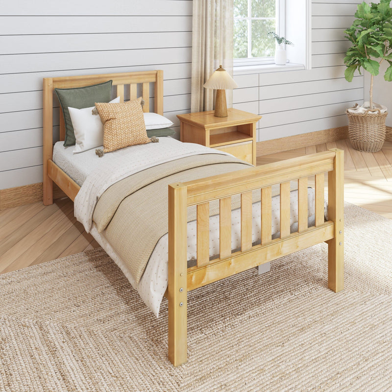 Cozy neutral bedroom with natural wood bed, beige bedding and knit pillows, wooden nightstand with lamp, shiplap wall and potted fiddle leaf fig plant