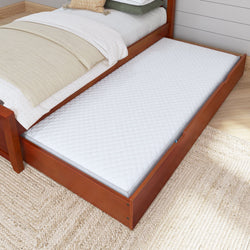 Trundle bed with white mattress in wooden frame for space-saving bedroom solutions.