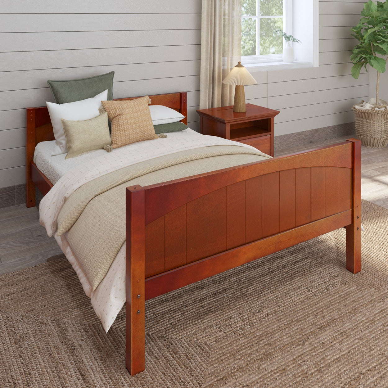 Wooden bed frame with beige bedding and decorative pillows in a cozy bedroom setting.