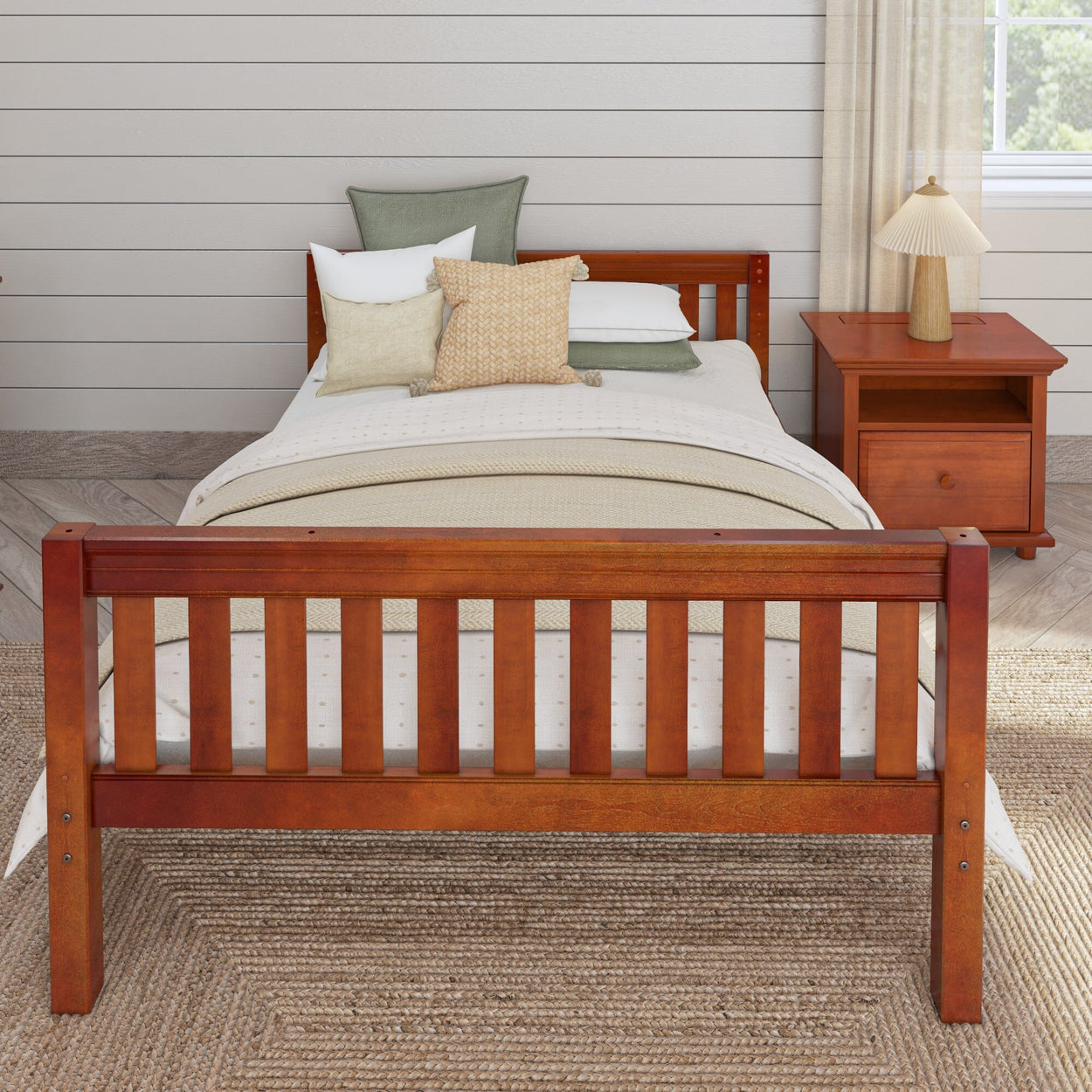 Wooden bed frame with cozy pillows and beige bedding in a modern bedroom with matching nightstand.