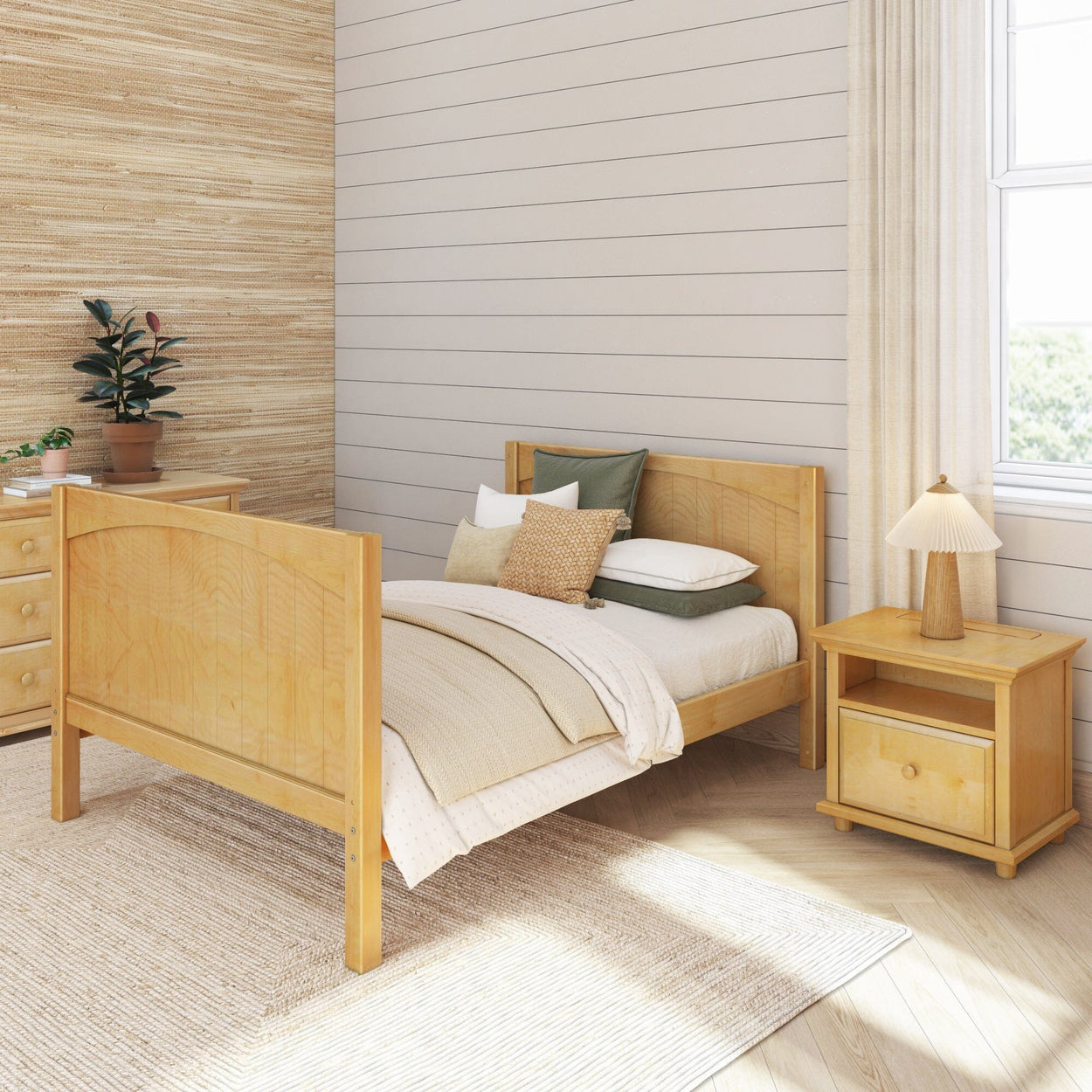 Cozy minimalist bedroom interior with wooden furniture, neutral bedding, and a potted plant.