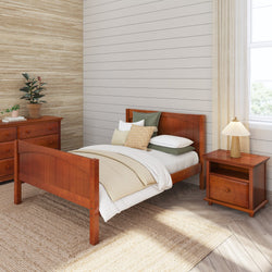 Wooden bedroom furniture set with bed, nightstand, and dresser in a cozy, natural-toned room.