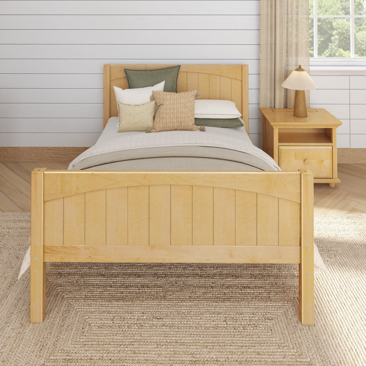 Wooden bed with decorative pillows and matching nightstand in a cozy bedroom setting.