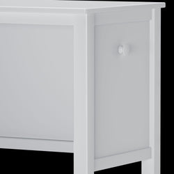 White wooden side table corner with knob detail.