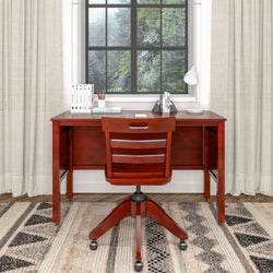 Elegant home office setup with wooden desk and chair set by a large window offering a scenic nature view.