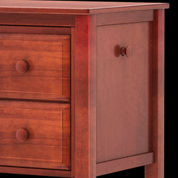 Wooden dresser with three drawers featuring round knobs, showcasing rich brown finish and classic design.