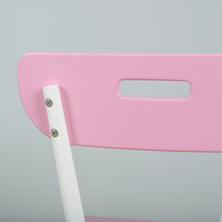 Pink folding chair with white frame and modern design, close-up view.