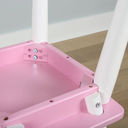 Pink wooden table with white legs on wooden floor.