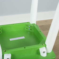 Green and white stool showing underside construction and screw details on wooden floor.
