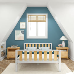Cozy attic bedroom with modern wooden bed, blue accent wall, and decorative elements, creating a serene and stylish space.