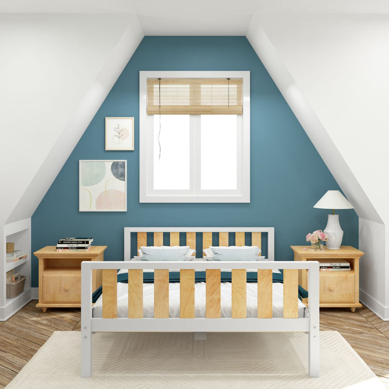 Attic bedroom with teal accent wall, white-framed window with bamboo blinds, white-and-wood slatted bed, matching wooden nightstands, table lamp and floral decor