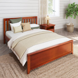 Modern bedroom with a wooden bed frame, neutral bedding, side table and indoor plant.