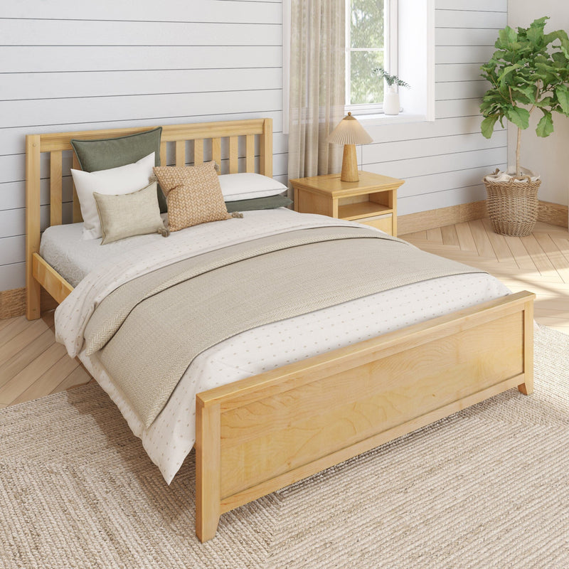 Cozy neutral farmhouse bedroom with natural wood bed frame, layered beige bedding and pillows, shiplap wall, wooden nightstand with lamp, woven rug and potted fiddle leaf fig plant