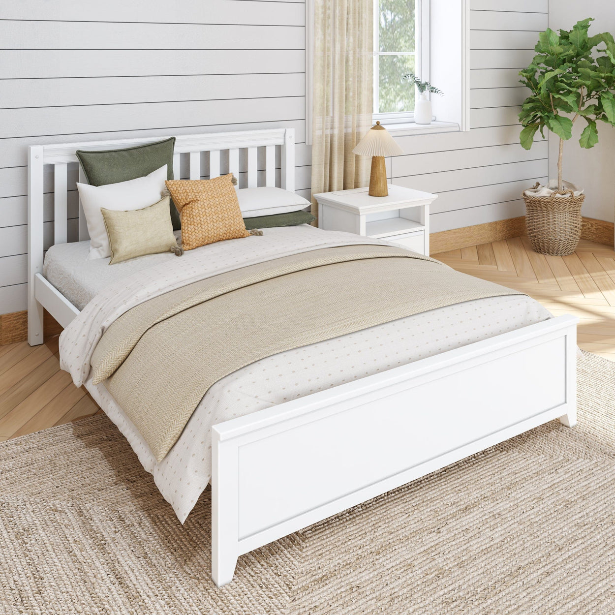 Cozy bedroom with white bed, beige bedding, decorative pillows, and a bedside table with a lamp, styled with a modern and minimalist design.