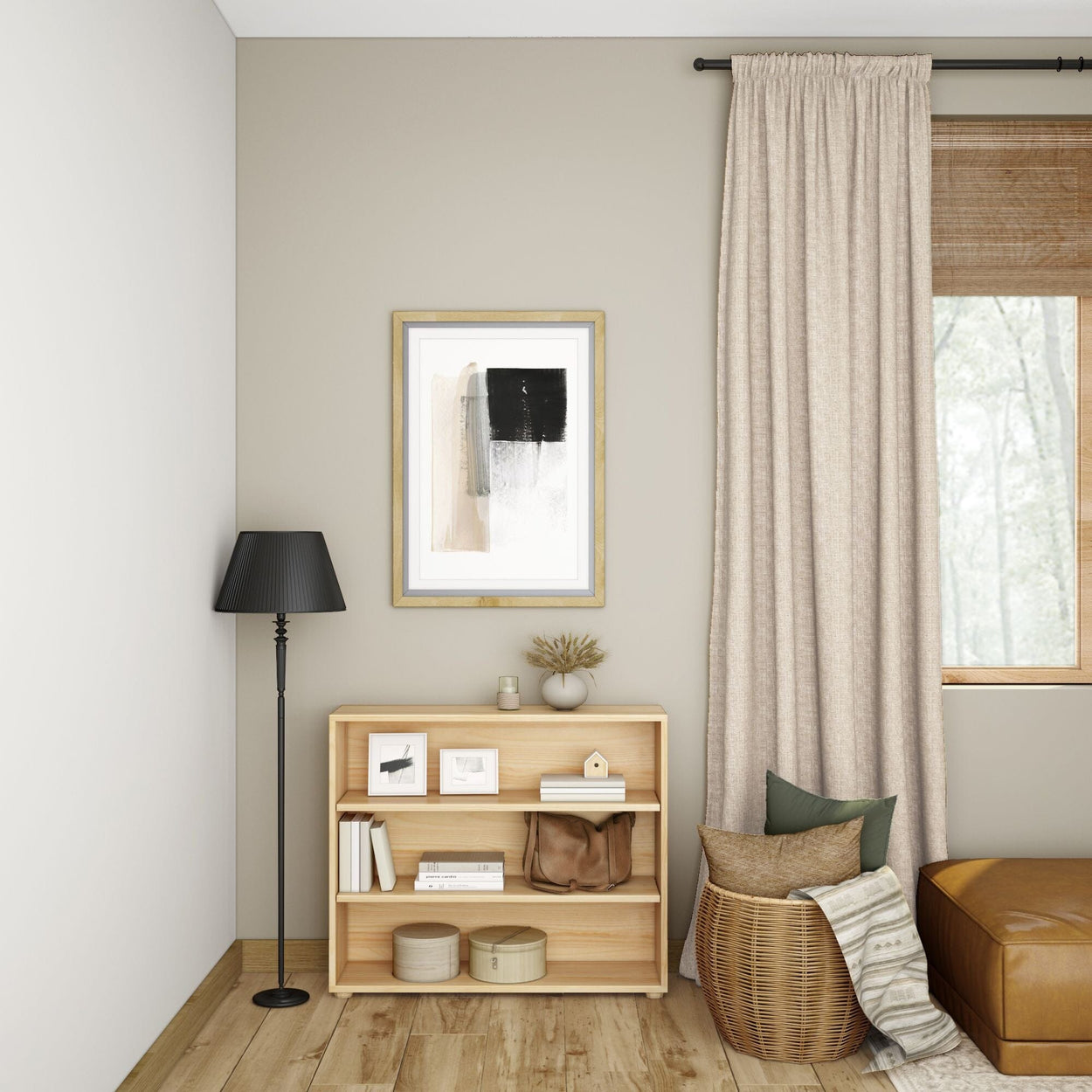 Minimalist living room with a wooden bookshelf, black floor lamp, and abstract wall art, featuring beige curtains and a cozy seating area.