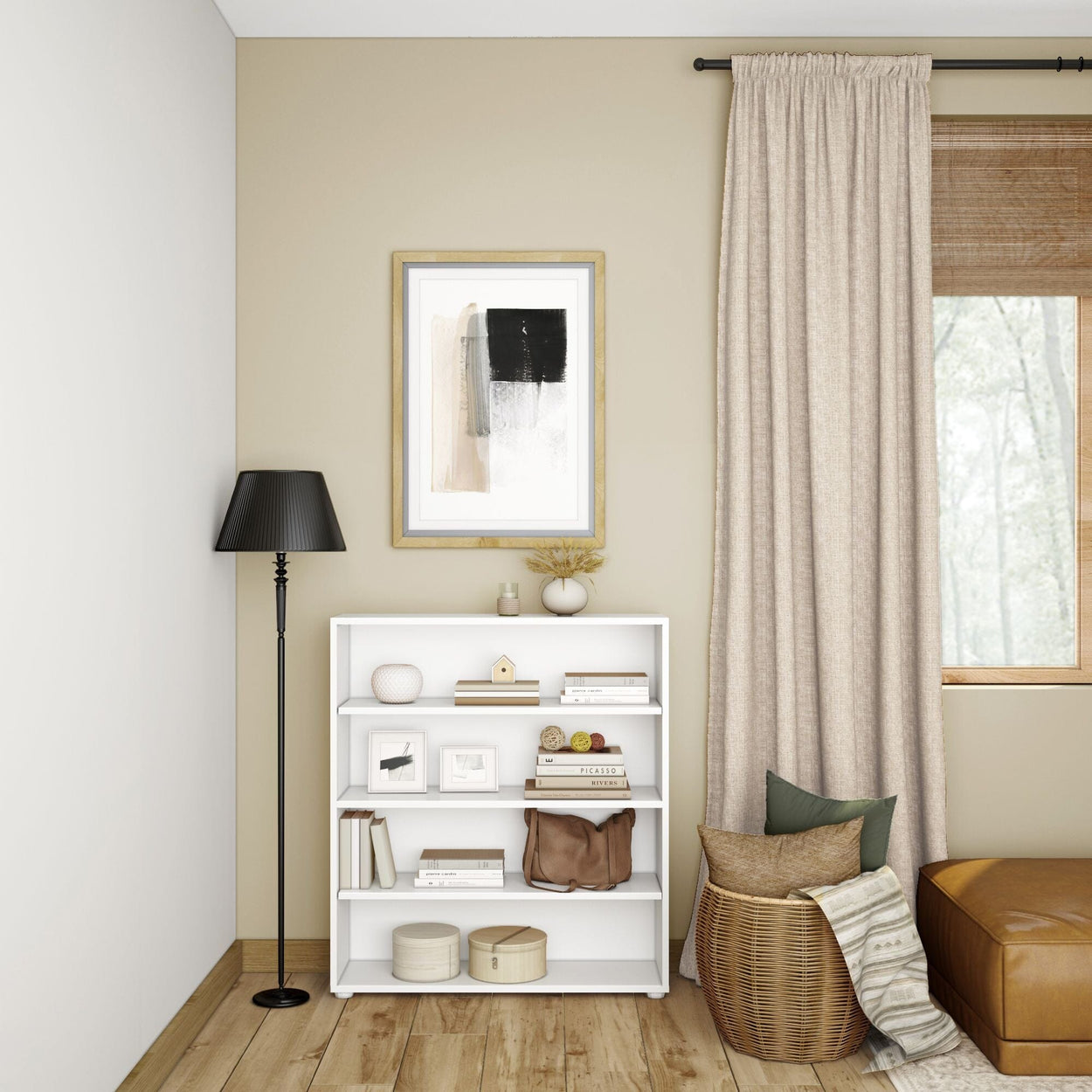 Cozy modern living room with white bookshelf, black floor lamp, abstract wall art, and natural decor elements.