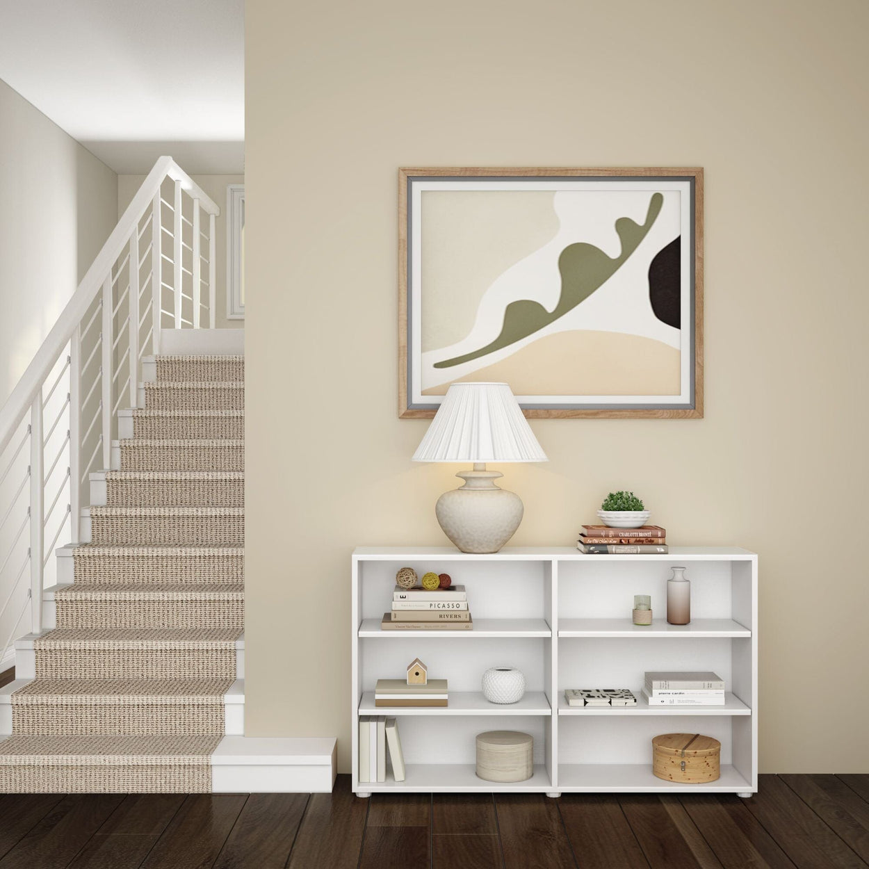 Modern living room interior with staircase, abstract wall art, elegant lamp on white shelf, and minimalist decor.