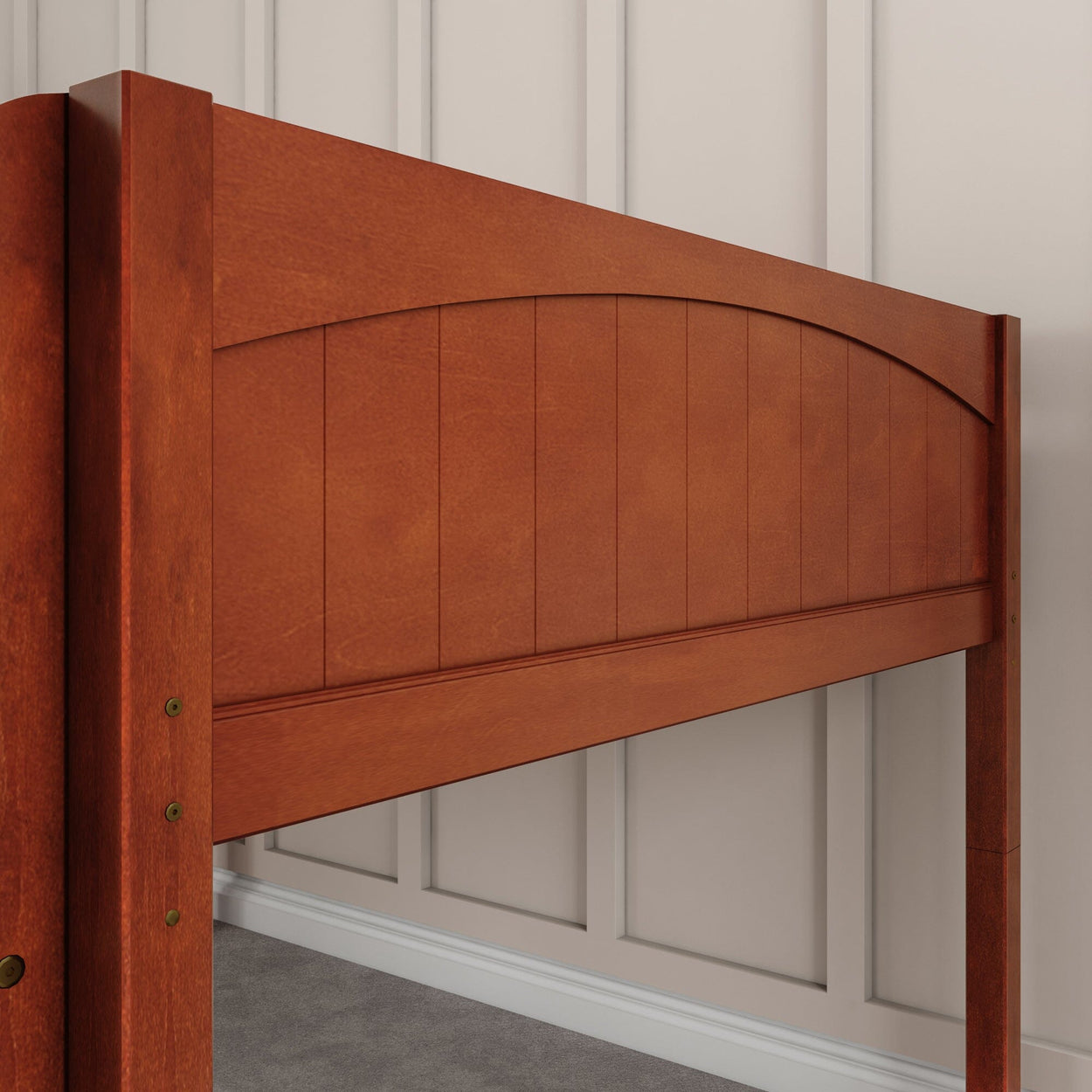 Wooden headboard with a natural finish against a paneled wall in a modern bedroom.