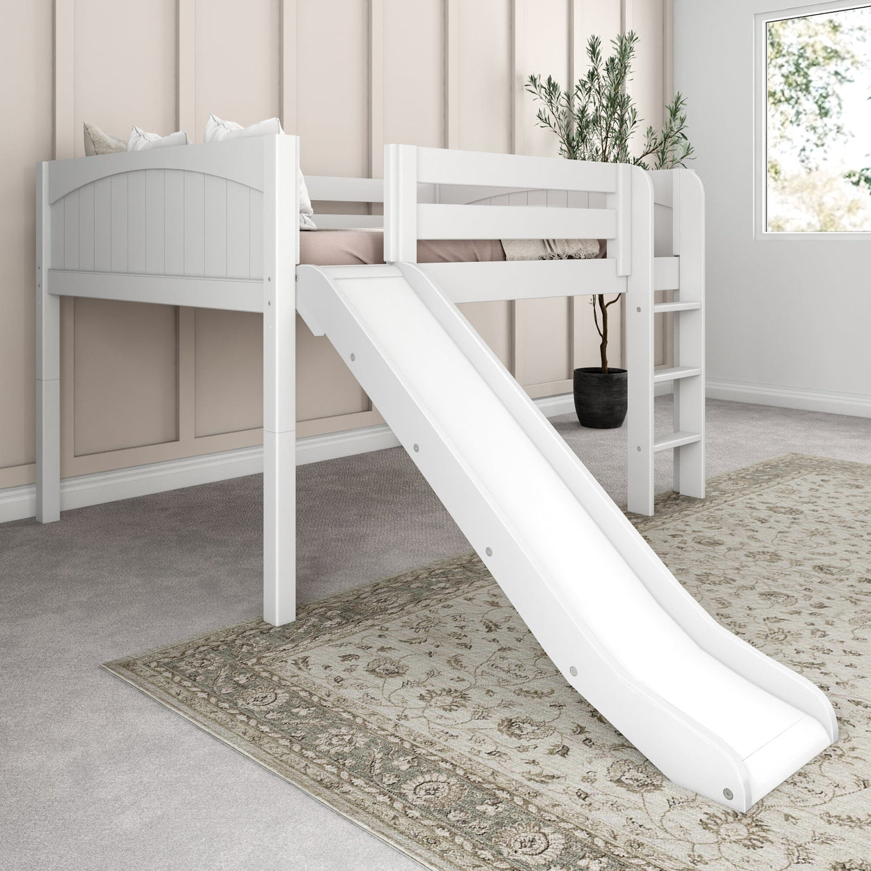 Children's white loft bed with slide and stairs in a cozy bedroom with beige walls and decorative carpet.