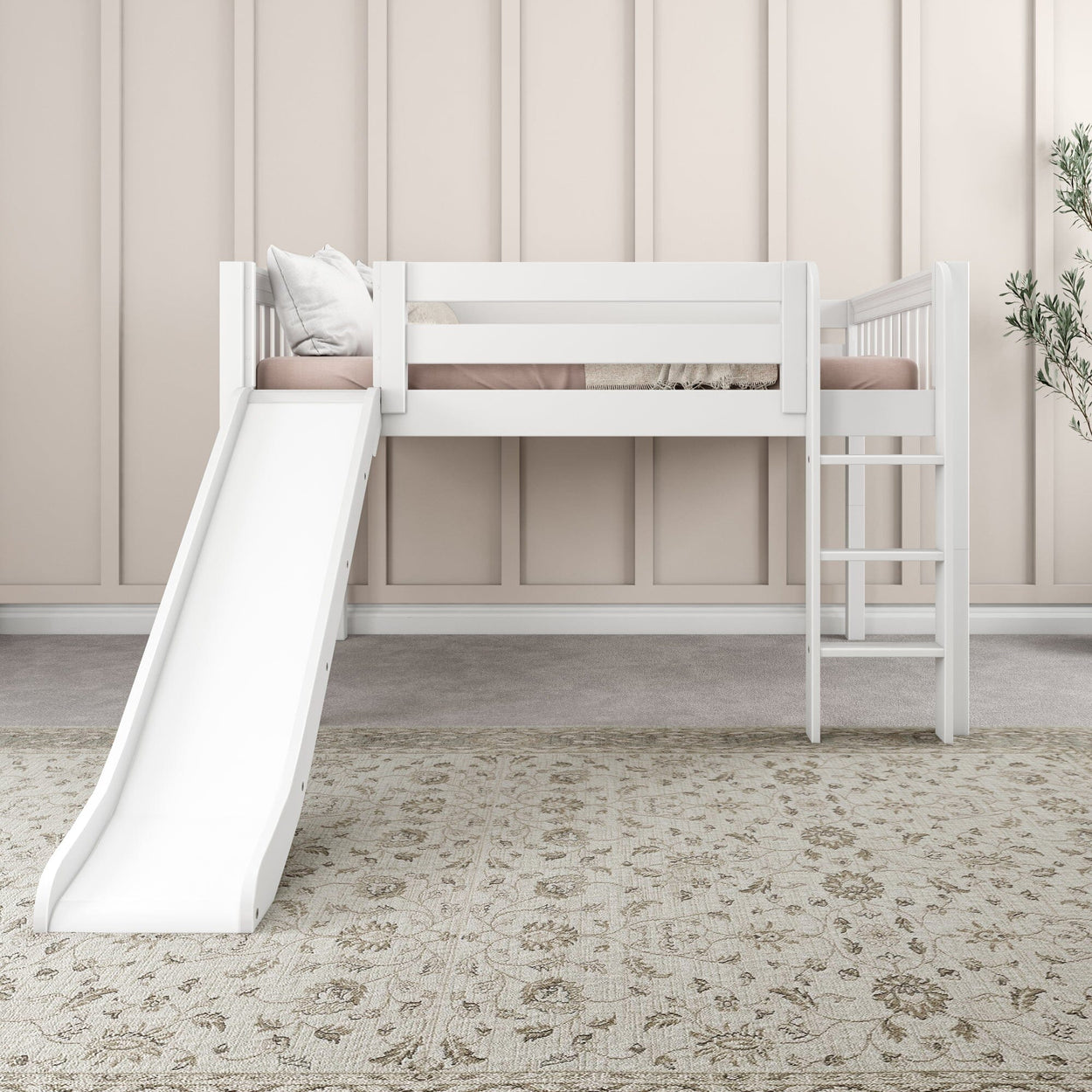 White children's loft bed with slide and ladder in a stylish bedroom, featuring a neutral color palette and decorative rug.