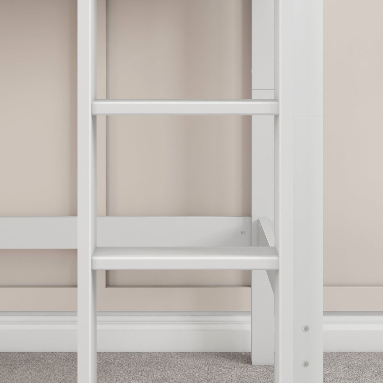 White ladder shelf against beige wall in modern home interior.