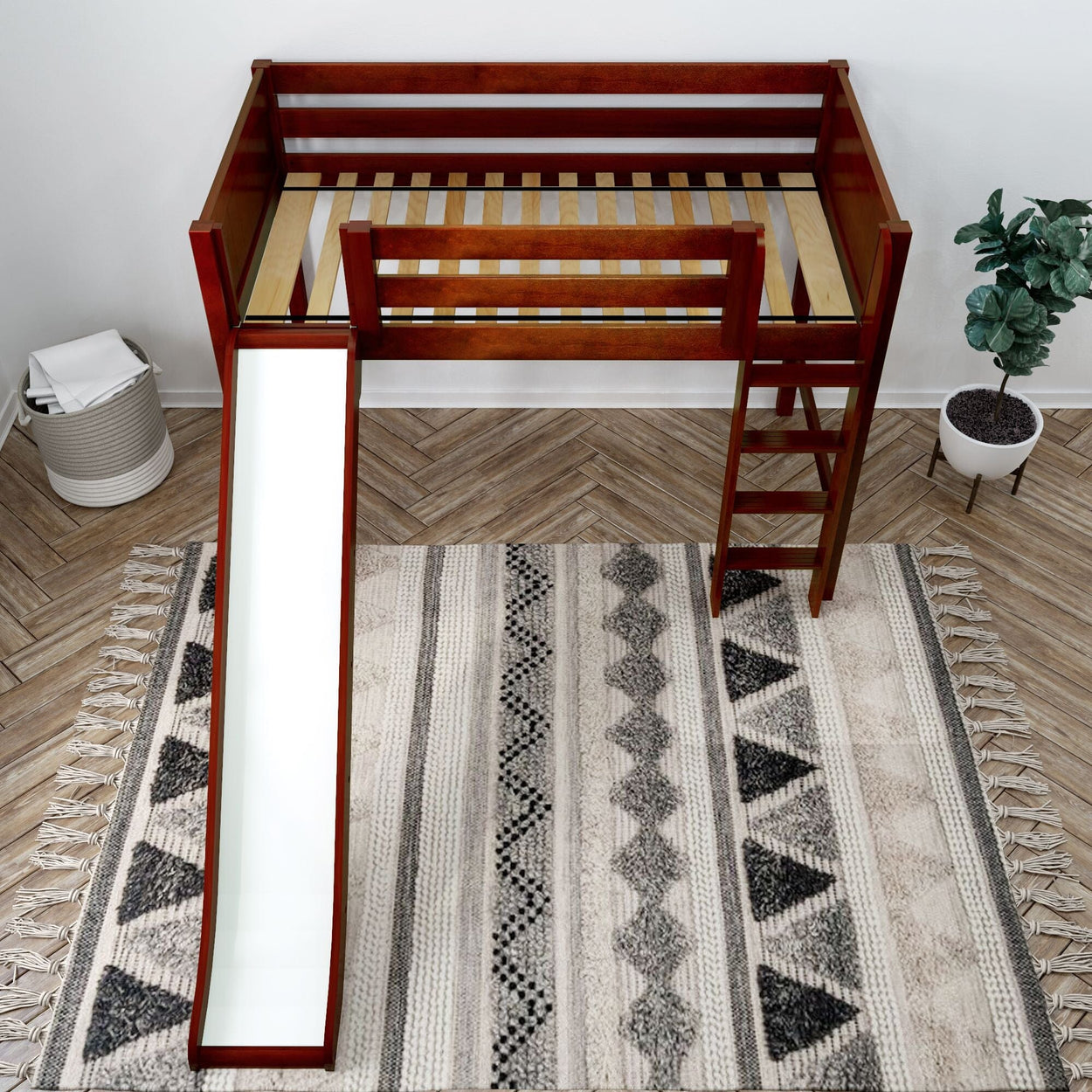 Kids' wooden loft bed with slide and ladder on patterned rug, modern bedroom furniture.