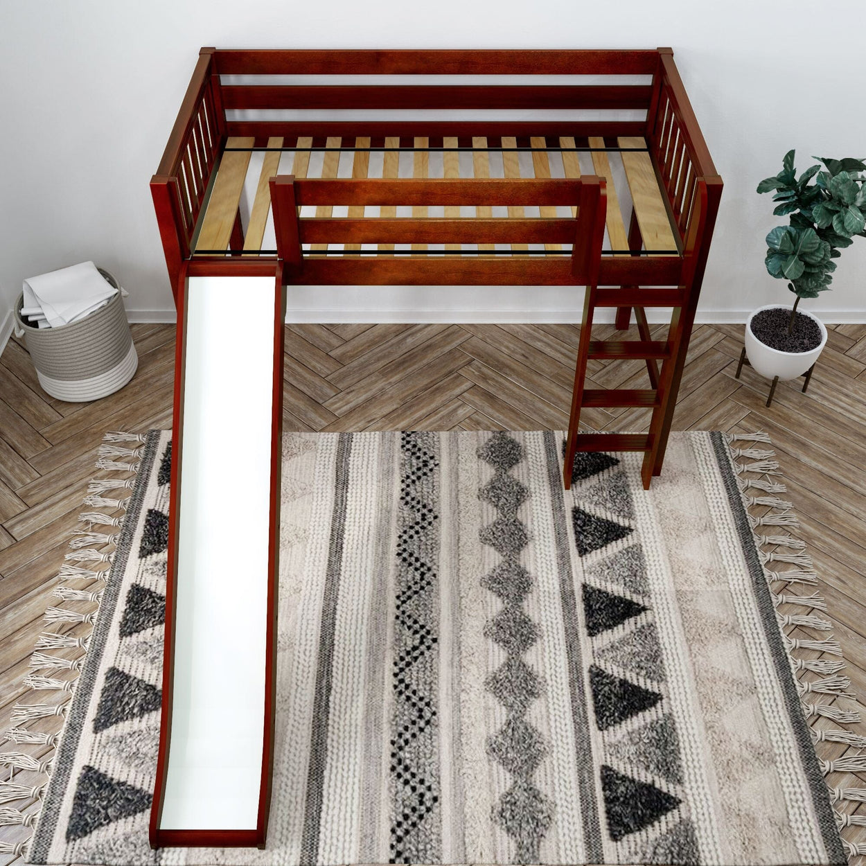 Loft bed with slide and ladder on patterned rug in a modern bedroom setting.