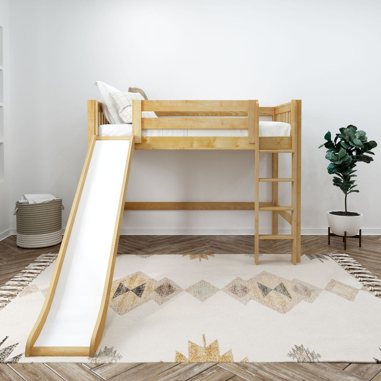 Children's loft bed with slide in modern bedroom setting, featuring geometric patterned rug and indoor plants.