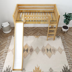 Wooden kids loft bed with slide, ladder, and modern geometric rug in cozy bedroom setting.