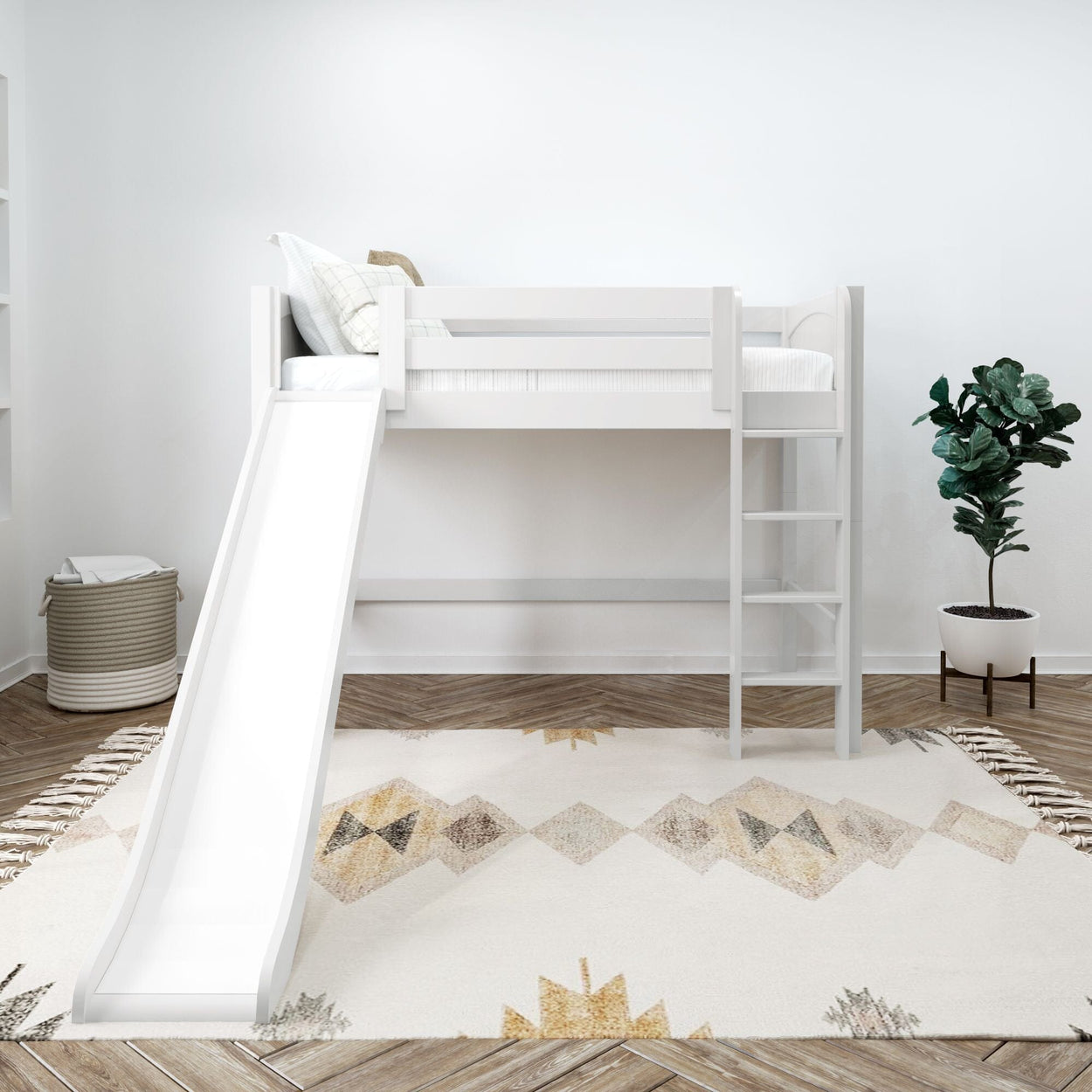 White loft bed with slide and ladder in modern kids room with geometric rug and green plant.