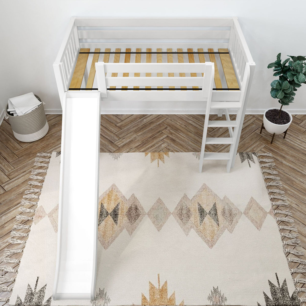 Children's white loft bed with slide and ladder on a patterned rug in a stylish bedroom setting.