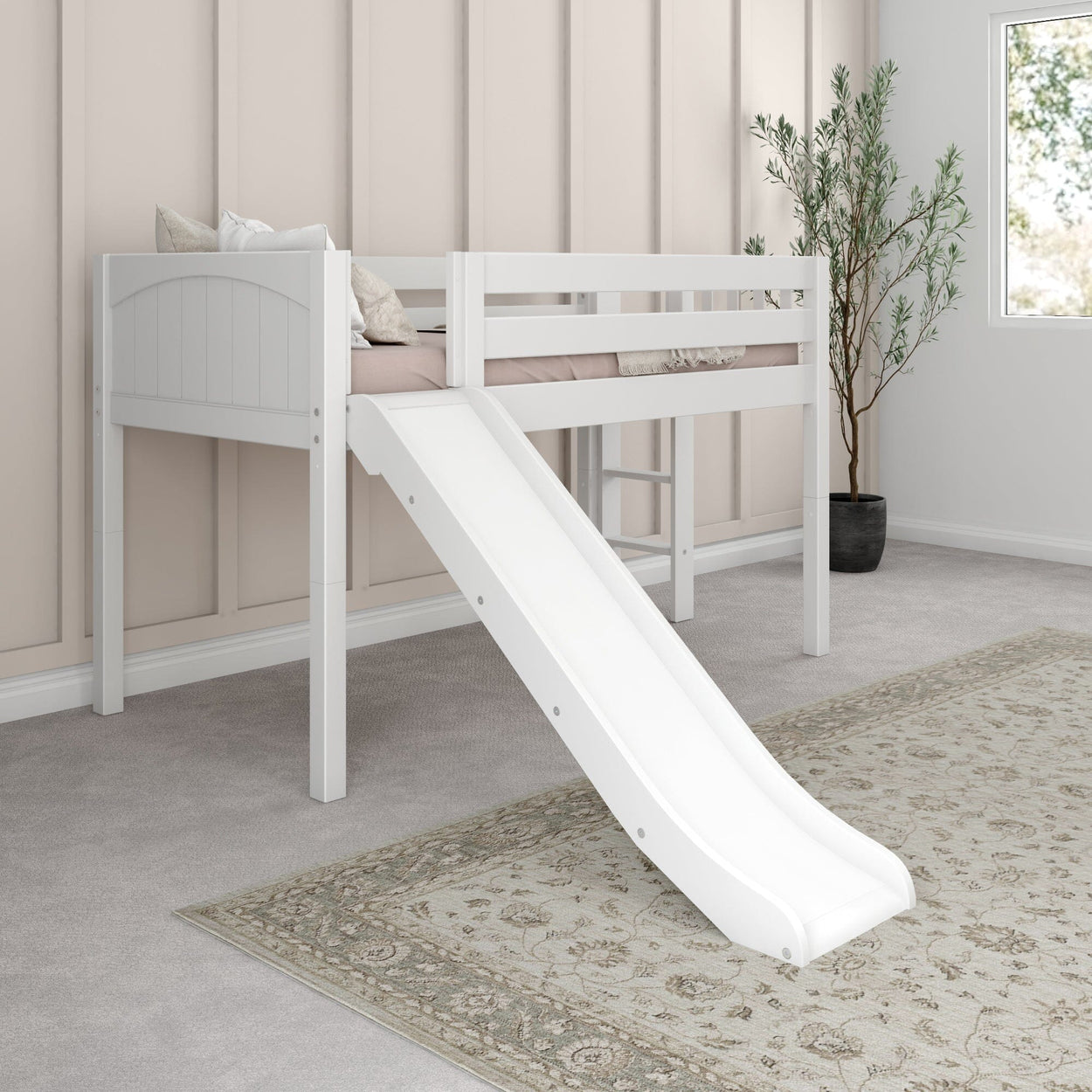 White loft bed with slide in a modern children's bedroom.