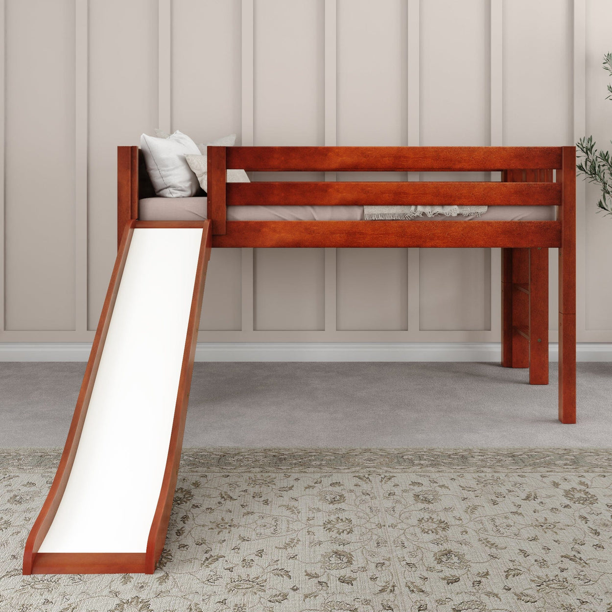 Wooden loft bed with slide and guardrails in a stylish bedroom setting.