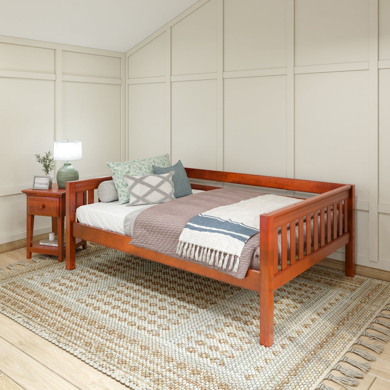 Elegant wooden daybed with cozy pillows and blanket in a serene bedroom setting, featuring a soft rug and ambient lighting.
