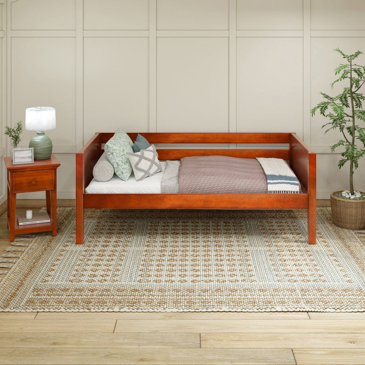 Stylish wooden daybed in cozy living room with decorative pillows and side table.