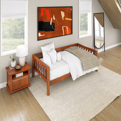 Cozy attic bedroom with wooden daybed and modern decor elements.